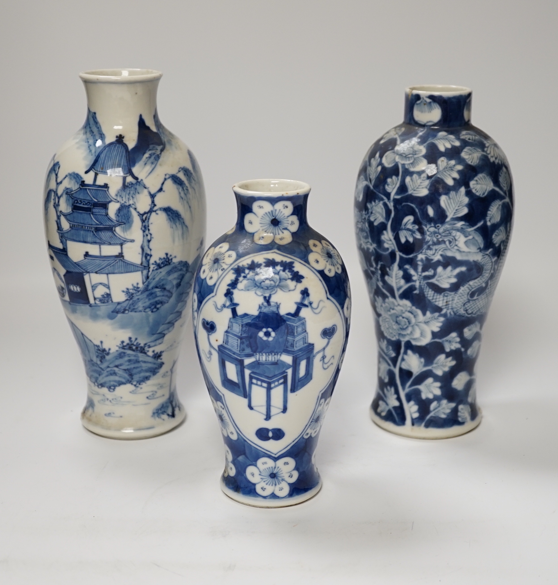 Three 19th century Chinese blue and white vases, tallest 23.5cm